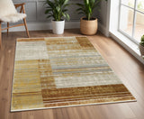 4' X 6' Rust Gold Blue Grey Ivory And Tan Geometric Power Loom Stain Resistant Area Rug With Fringe