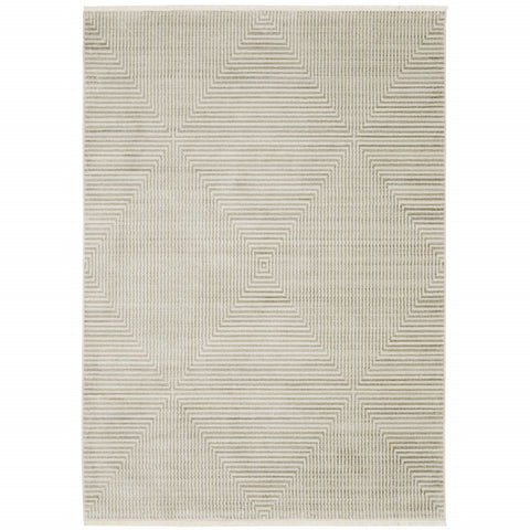 5' X 8' Ivory Beige Taupe And Tan Geometric Power Loom Stain Resistant Area Rug With Fringe