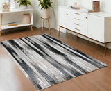4' X 6' Black Silver and Gray Abstract Power Loom Area Rug
