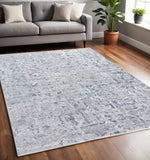 5' X 8' Blue and Gray Abstract Distressed Area Rug With Fringe