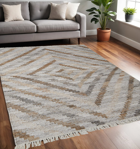5' X 8' Gray And Brown Geometric Hand Woven Area Rug With Fringe