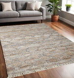 5' X 8' Tan and Gray Geometric Hand Woven Area Rug With Fringe