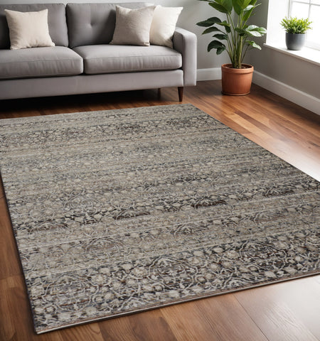 5' X 8' Gray and Ivory Abstract Distressed Area Rug With Fringe