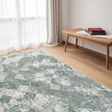 5' X 8' Green And Ivory Patchwork Distressed Stain Resistant Area Rug