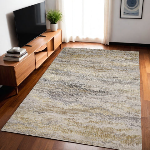 5' X 8' Gold Gray And Ivory Abstract Area Rug