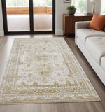 5' X 8' Gold And Ivory Floral Stain Resistant Area Rug