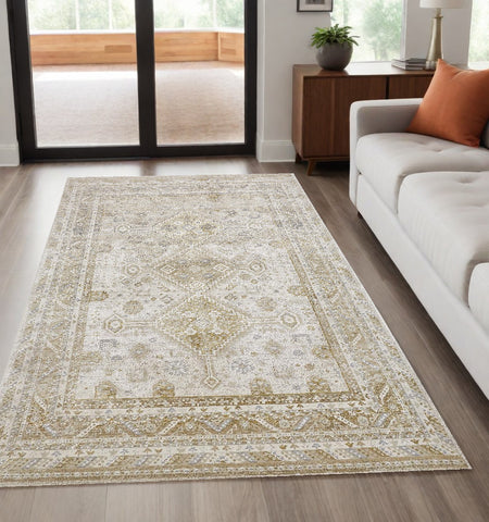 5' X 8' Gold And Ivory Floral Stain Resistant Area Rug