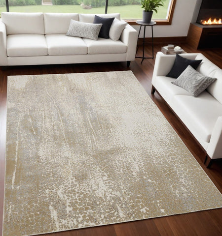 5' X 8' Gold Gray And Ivory Abstract Area Rug