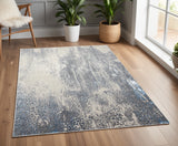 4' X 6' Ivory Gray And Blue Abstract Area Rug