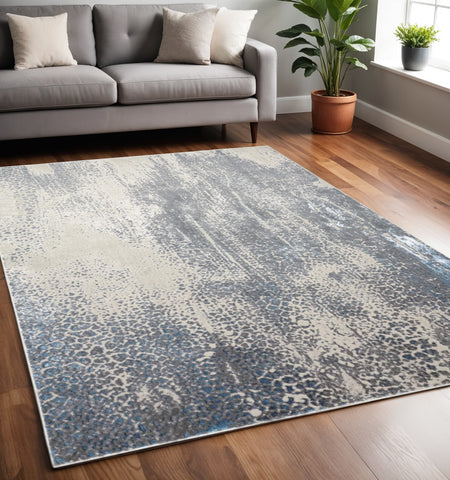 5' X 8' Ivory Gray And Blue Abstract Area Rug