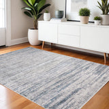 4' X 6' Ivory Gray And Blue Abstract Area Rug