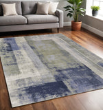 5' X 8' Blue Green And Ivory Abstract Distressed Area Rug