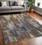 5' X 8' Brown Blue And Ivory Abstract Distressed Area Rug