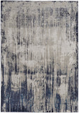 5' X 8' Tan Blue And Ivory Abstract Power Loom Distressed Area Rug