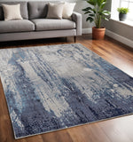 5' X 8' Ivory and Blue Abstract Power Loom Distressed Non Skid Area Rug