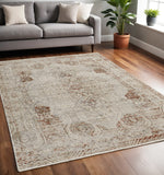 5' X 8' Tan and Ivory Floral Power Loom Distressed Non Skid Area Rug With Fringe
