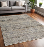 5' X 8' Tan and Ivory Geometric Power Loom Distressed Non Skid Area Rug With Fringe