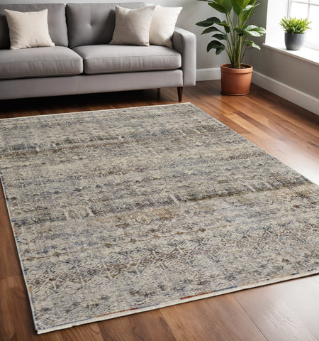 5' X 8' Tan and Ivory Geometric Power Loom Distressed Non Skid Area Rug With Fringe