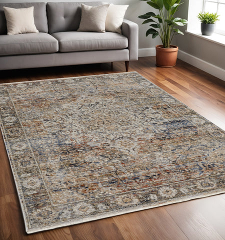 5' X 8' Tan and Blue Floral Power Loom Distressed Non Skid Area Rug With Fringe