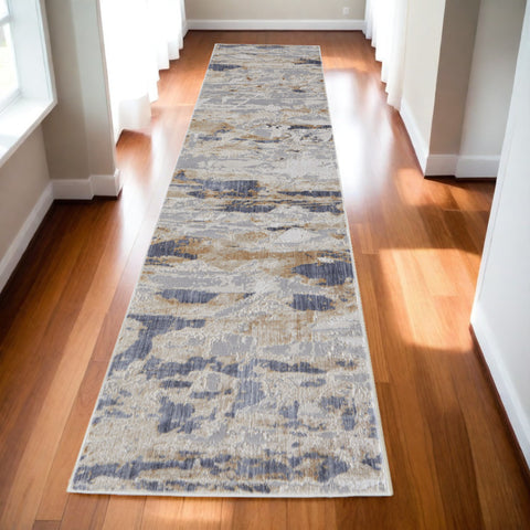 10' Tan and Ivory Abstract Power Loom Distressed Non Skid Runner Rug