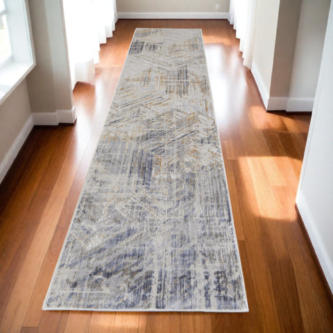 10' Tan and Ivory Abstract Power Loom Distressed Non Skid Runner Rug