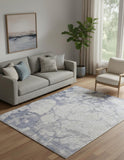 5' X 8' Ivory And Blue Abstract Power Loom Distressed Area Rug