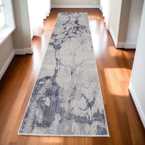 10' Ivory and Blue Abstract Power Loom Distressed Non Skid Runner Rug