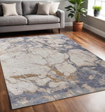 5' X 8' Tan Blue And Beige Abstract Distressed Area Rug