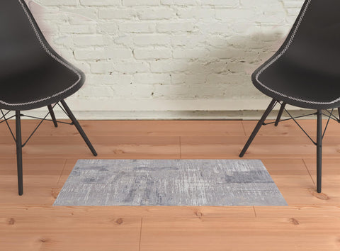 2' X 3' Taupe Tan And Blue Abstract Power Loom Distressed Stain Resistant Area Rug