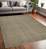 5' X 8' Tan And Green Hand Woven Area Rug