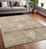 5' X 8' Tan Ivory And Brown Abstract Area Rug