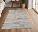 4' X 6' Brown Ivory And Tan Abstract Distressed Area Rug