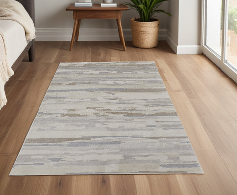 4' X 6' Brown Ivory And Tan Abstract Distressed Area Rug
