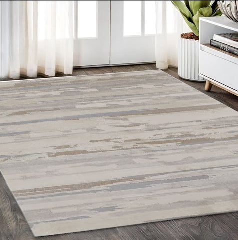 5' X 8' Brown Ivory And Tan Abstract Distressed Area Rug