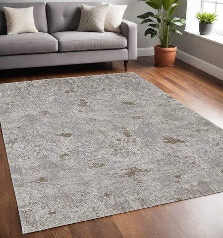 5' X 8' Gray Ivory And Tan Abstract Distressed Area Rug