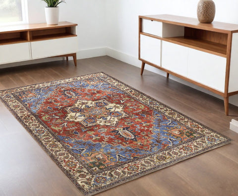 4' X 6' Blue And Orange Floral Medallion Area Rug