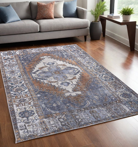 5' X 8' Blue And Ivory Floral Medallion Area Rug