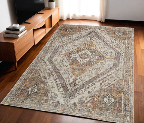 5' X 8' Brown Ivory And Orange Medallion Distressed Washable Area Rug