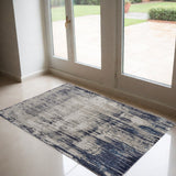 2' X 3' Tan And Blue Abstract Distressed Area Rug