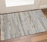2' X 3' Brown Ivory And Tan Abstract Distressed Area Rug
