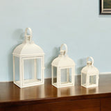 Set of Three Ivory Distressed Glass And Metal Floor Lantern Candle Holders