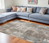 8' X 10' Ivory Brown And Green Abstract Area Rug