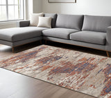 6' X 9' Beige Rust And Blue Abstract Area Rug