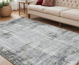 5' X 8' Ivory Blue And Gray Abstract Area Rug