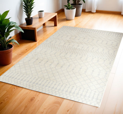 4' X 6' Blue and Ivory Abstract Power Loom Washable Area Rug