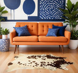 5' X 7' Brown and White Cowhide Hand Knotted Area Rug
