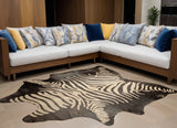 5' X 7' Black and Off White Cowhide Hand Knotted Area Rug