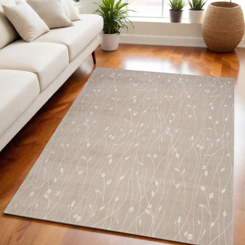 5' X 7' Beige and Ivory Floral Power Loom Area Rug