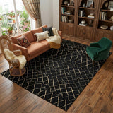6' X 9' Black and Ivory Abstract Power Loom Distressed Area Rug