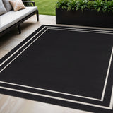 5' X 7' Black And Ivory Indoor Outdoor Area Rug